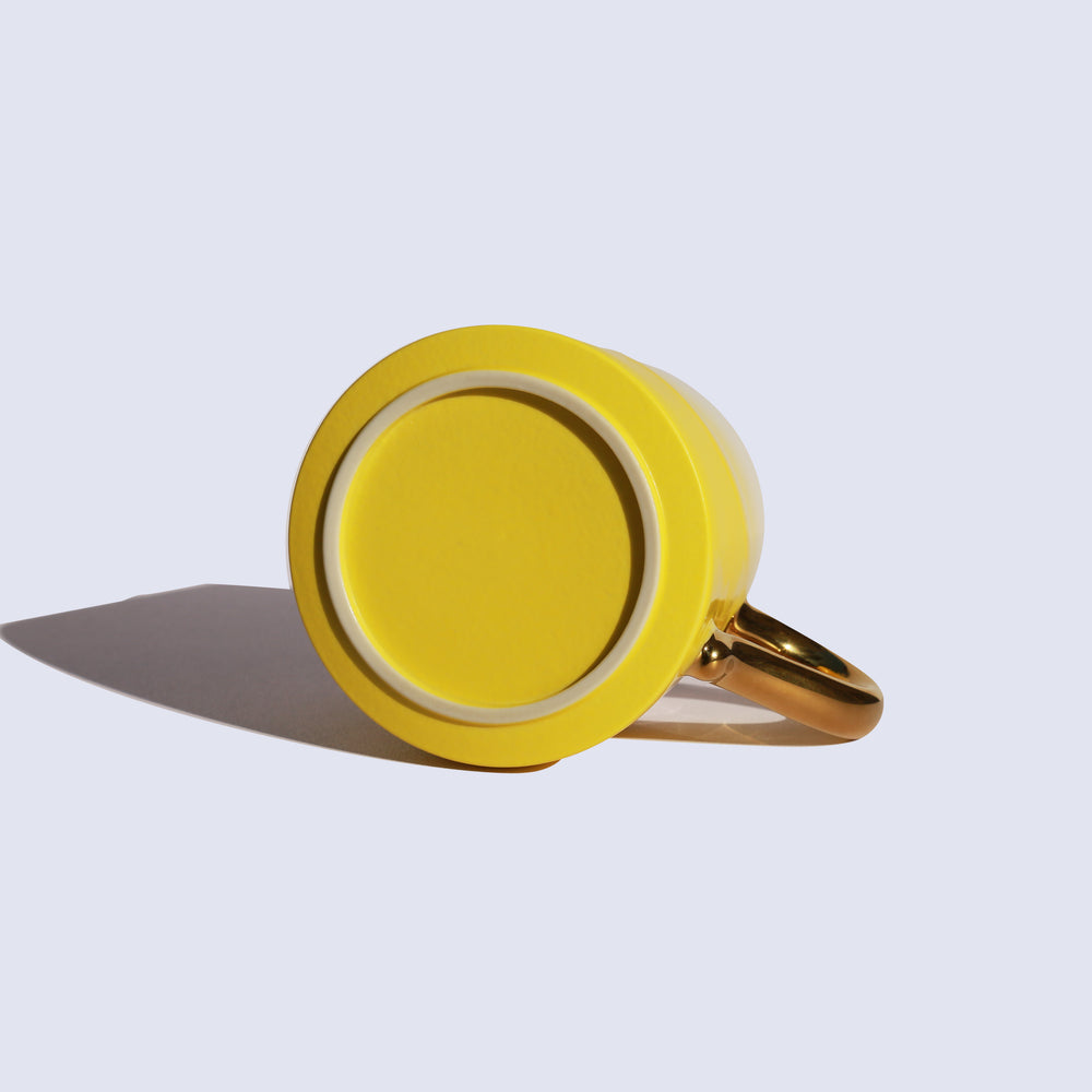 
                  
                    Yellow Coffee Mug with Gold Handle
                  
                