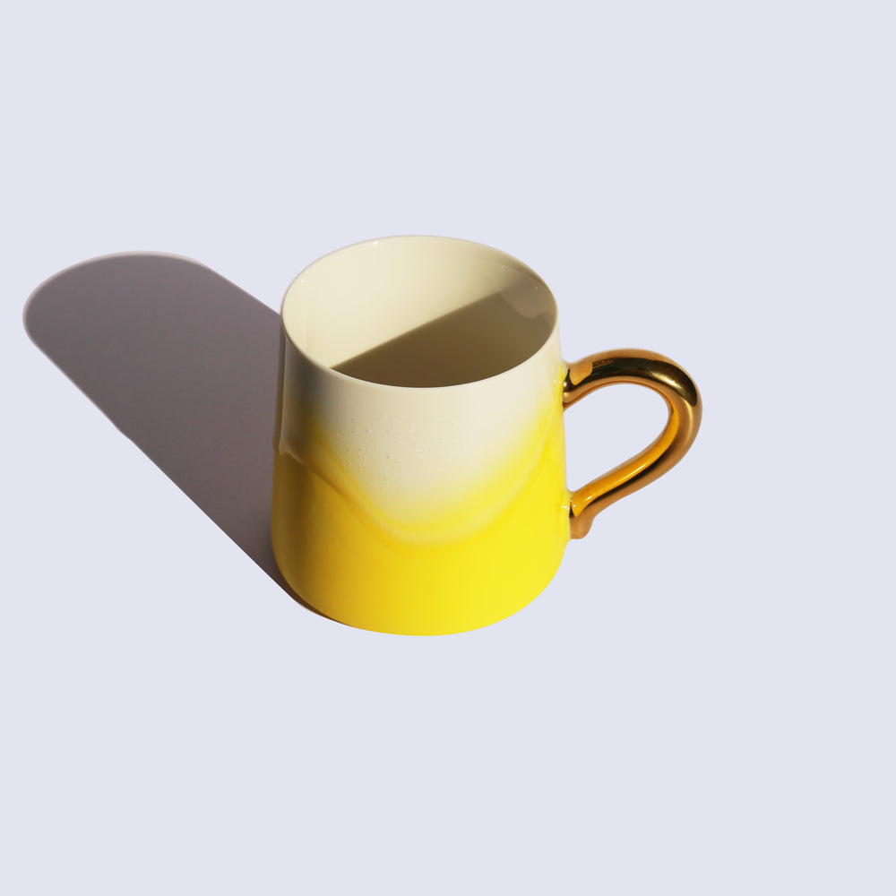 
                  
                    Yellow Coffee Mug with Gold Handle
                  
                