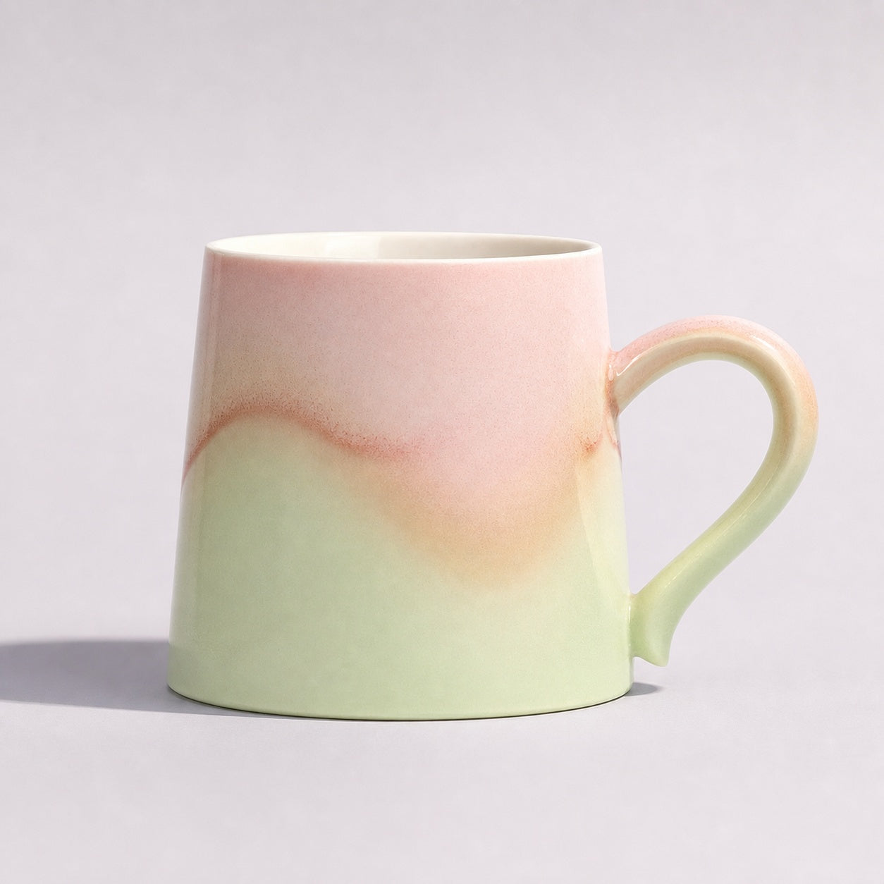 Cheralle Tide Collection Cherry Blush mug with a spring-green lower glaze, front view
