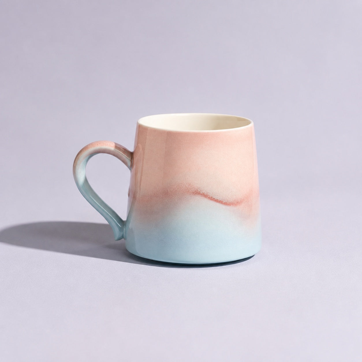 Pastel blue and blush mug from an alternate front angle